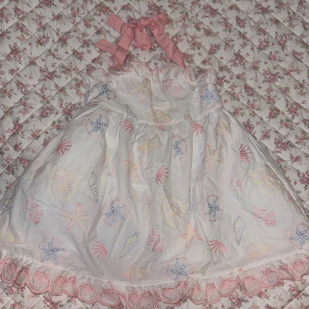 White Dress with Pink Accents and Sea Motifs